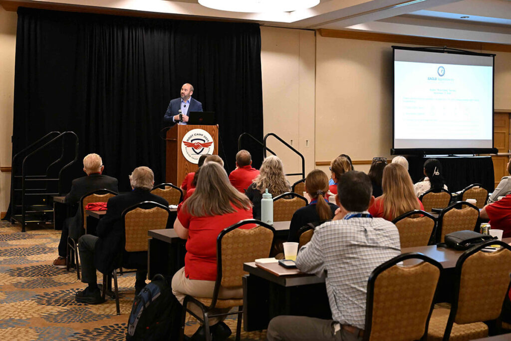 Audience listening to man speak about Boot Camp.